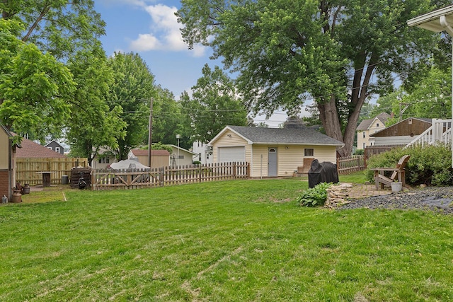 310 Belle St W, Cannon Falls, MN 55009 - fenced backyard with an outdoor structure and a garage