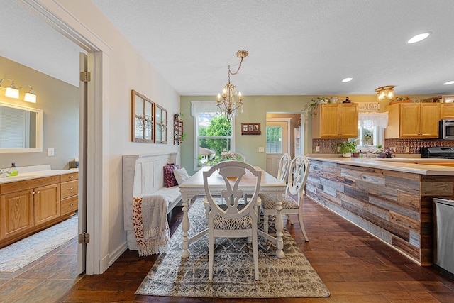 310 Belle St W, Cannon Falls, MN 55009 - dining room featuring dark wood-type flooring, a chandelier, recessed lighting, and a textured ceiling
