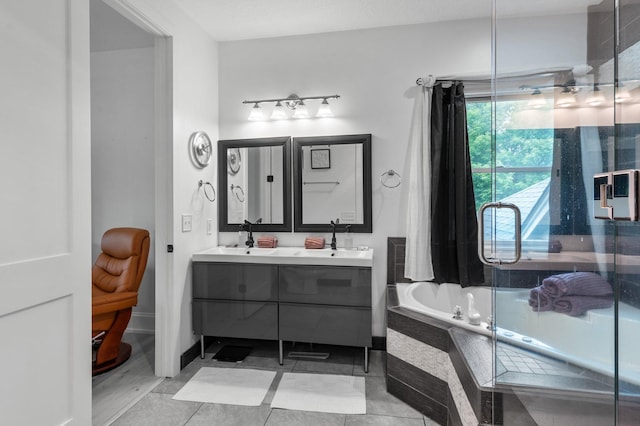 7447 213th St N, Forest Lake, MN 55025 - bathroom featuring double vanity, a garden tub, a shower stall, and tile patterned flooring