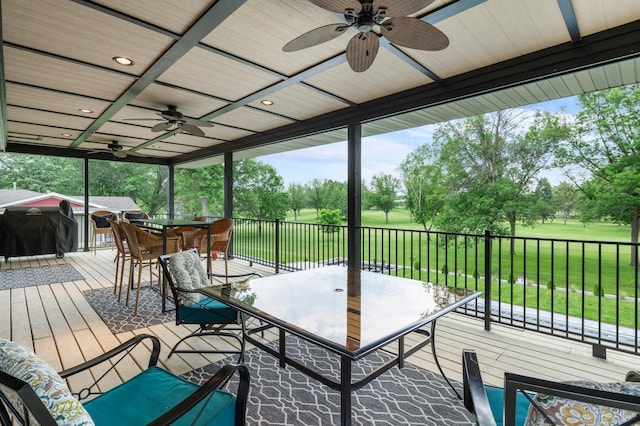 7447 213th St N, Forest Lake, MN 55025 - wooden deck featuring outdoor dining area, ceiling fan, view of scattered trees, view of golf course, and area for grilling