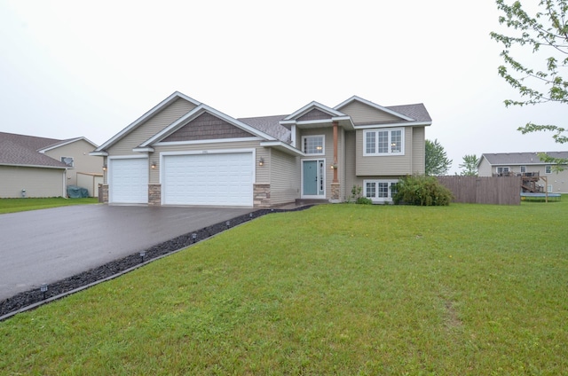 1046 Roosevelt St S, Cambridge, MN 55008 - view of front of house with driveway, a garage, and stone siding