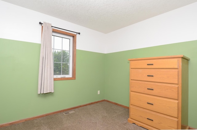 1046 Roosevelt St S, Cambridge, MN 55008 - unfurnished bedroom featuring carpet flooring and a textured ceiling