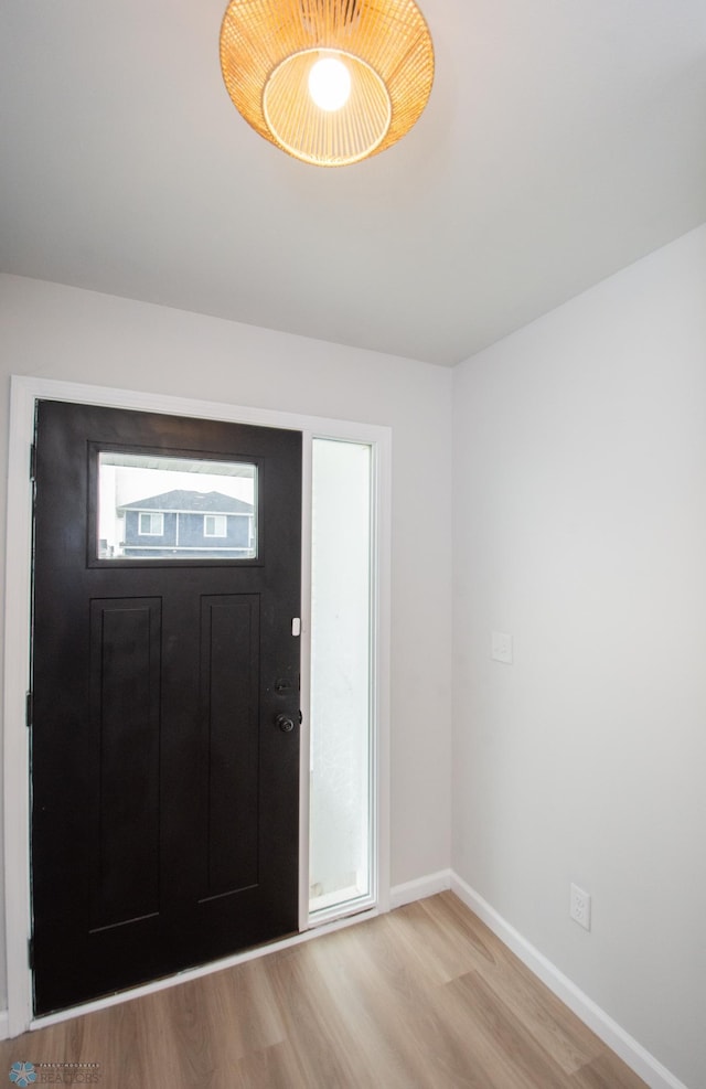 7364 27th St S, Fargo, ND 58104 - foyer featuring wood finished floors and baseboards