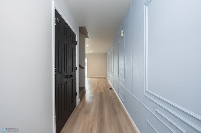 7364 27th St S, Fargo, ND 58104 - hall with light wood-style flooring and baseboards