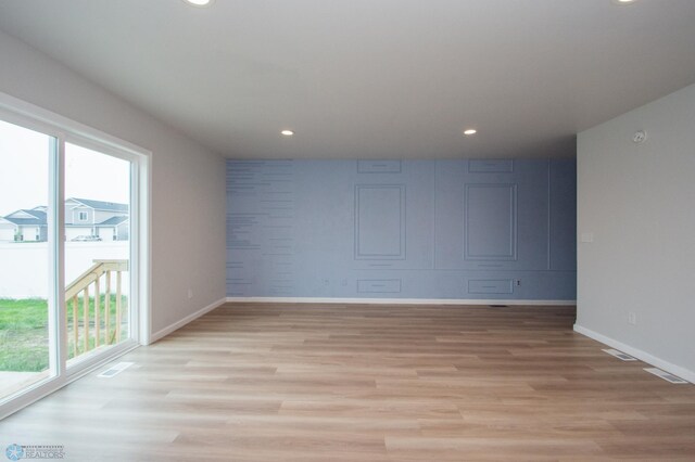 7364 27th St S, Fargo, ND 58104 - spare room with plenty of natural light, baseboards, light wood-style floors, and recessed lighting