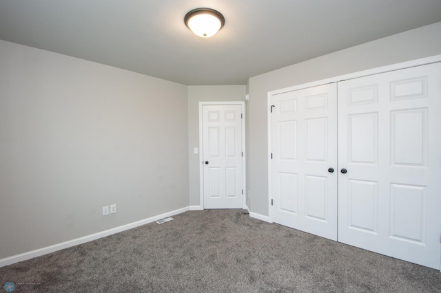 7364 27th St S, Fargo, ND 58104 - unfurnished bedroom featuring carpet flooring, a closet, and baseboards