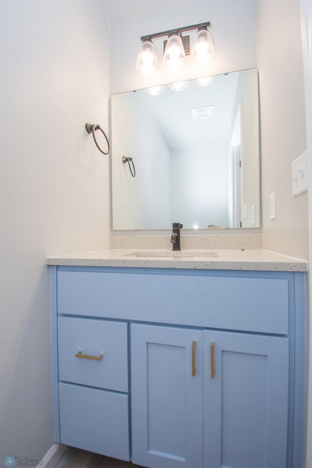 7364 27th St S, Fargo, ND 58104 - bathroom with vanity and baseboards