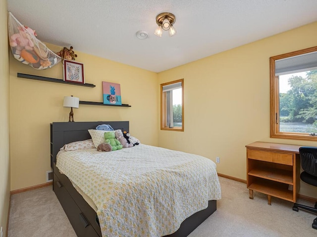 1875 26th Ave NW, New Brighton, MN 55112 - carpeted bedroom featuring baseboards