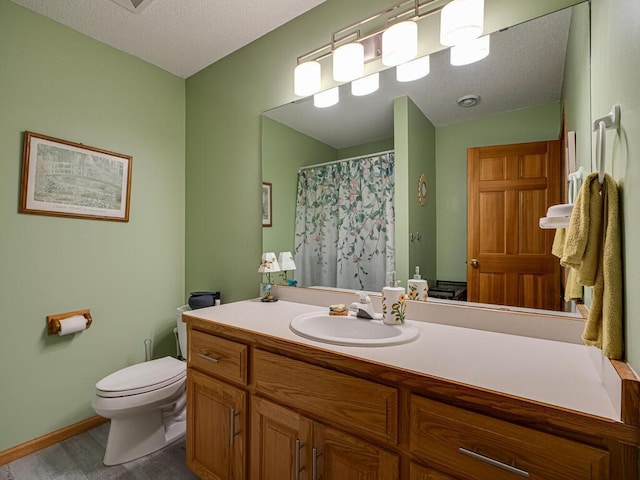 1875 26th Ave NW, New Brighton, MN 55112 - bathroom featuring vanity, toilet, baseboards, a textured ceiling, and a shower with shower curtain