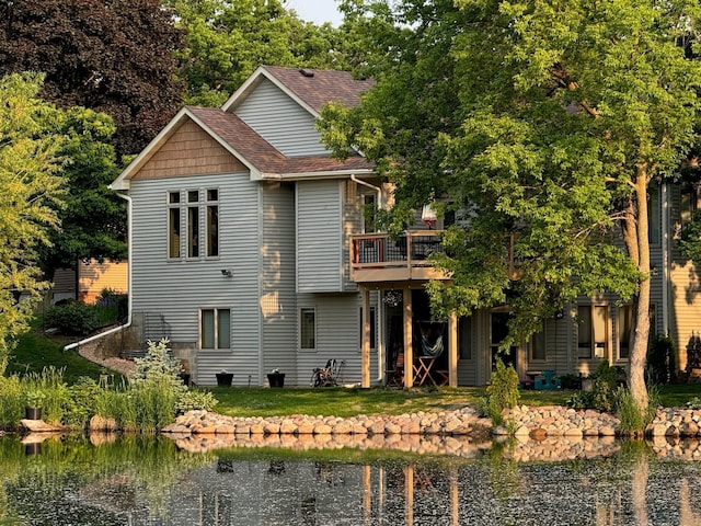 1875 26th Ave NW, New Brighton, MN 55112 - back of property with roof with shingles and a deck with water view