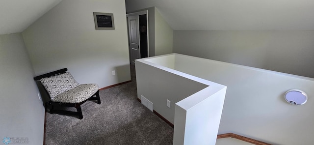 1442 11th Ave S, Fargo, ND 58103 - hall featuring carpet flooring, vaulted ceiling, and baseboards