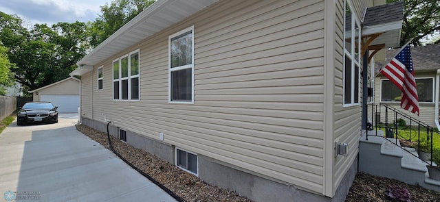 1442 11th Ave S, Fargo, ND 58103 - view of property exterior featuring a garage and an outdoor structure