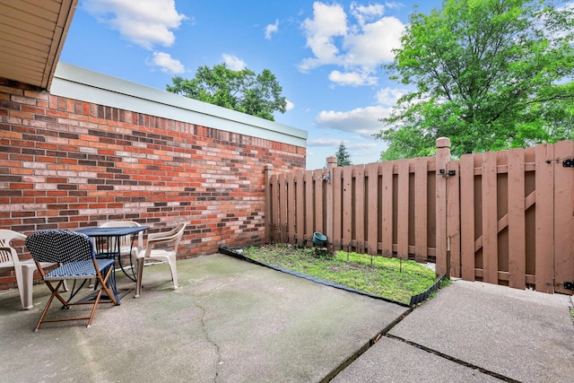 3625 Gettysburg Ave S Unit 40, Saint Louis Park, MN 55426 - view of patio / terrace with outdoor dining space and a gate
