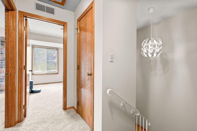 3625 Gettysburg Ave S Unit 40, Saint Louis Park, MN 55426 - corridor with carpet floors, an upstairs landing, a textured ceiling, and baseboards