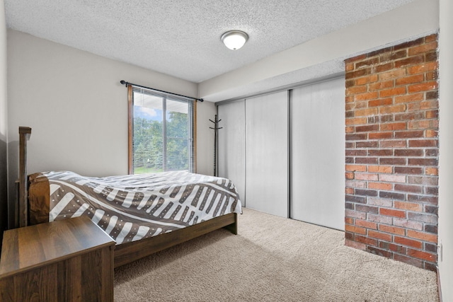 3625 Gettysburg Ave S Unit 40, Saint Louis Park, MN 55426 - carpeted bedroom featuring a closet and a textured ceiling
