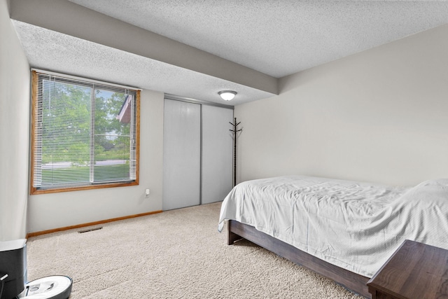 3625 Gettysburg Ave S Unit 40, Saint Louis Park, MN 55426 - carpeted bedroom with a textured ceiling and a closet
