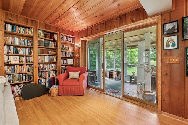 8482 150th St E, Northfield Twp, MN 55057 - sitting room featuring wood walls, wood finished floors, built in features, and wooden ceiling
