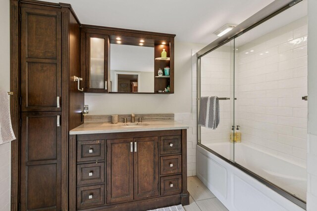 8482 150th St E, Northfield Twp, MN 55057 - full bathroom featuring vanity, bath / shower combo with glass door, and tile patterned flooring