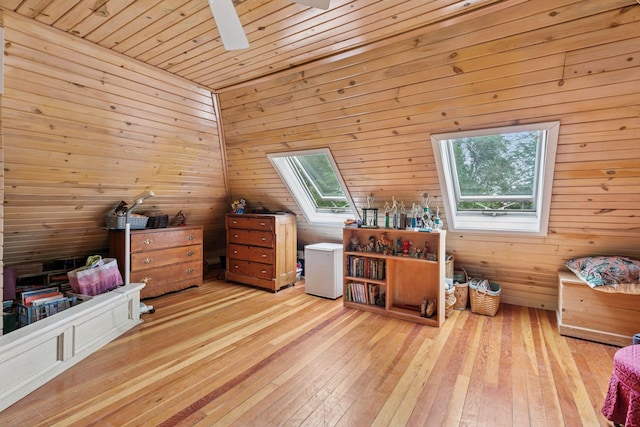 8482 150th St E, Northfield Twp, MN 55057 - bedroom featuring a skylight, light wood-type flooring, wood walls, and wood ceiling