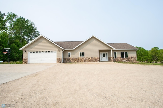 11905 Hunter Dr, Lake Park Twp, MN 56554 - ranch-style home with stone siding, a garage, and concrete driveway