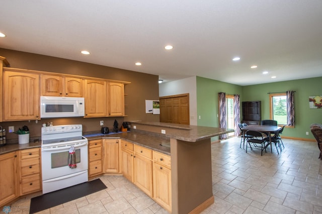 11905 Hunter Dr, Lake Park Twp, MN 56554 - kitchen with white appliances, a peninsula, light brown cabinetry, recessed lighting, and dark countertops