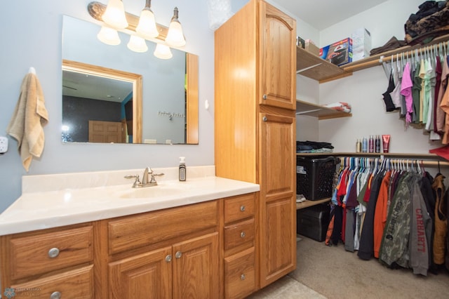 11905 Hunter Dr, Lake Park Twp, MN 56554 - bathroom featuring vanity and a walk in closet