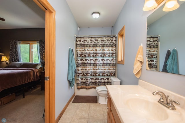 11905 Hunter Dr, Lake Park Twp, MN 56554 - bathroom featuring vanity, connected bathroom, toilet, tile patterned flooring, and a shower with shower curtain