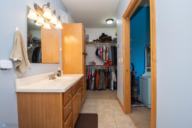 11905 Hunter Dr, Lake Park Twp, MN 56554 - full bathroom with vanity, a walk in closet, and tile patterned flooring