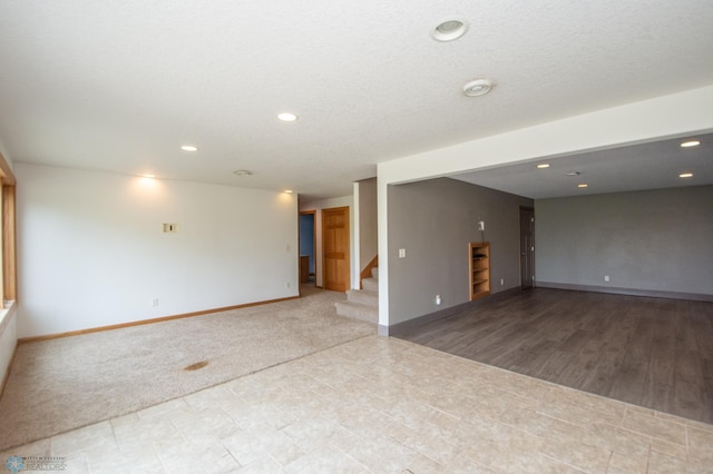 11905 Hunter Dr, Lake Park Twp, MN 56554 - unfurnished room featuring stairway, baseboards, and recessed lighting