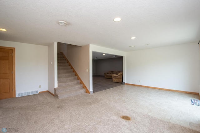 11905 Hunter Dr, Lake Park Twp, MN 56554 - unfurnished living room with stairs, recessed lighting, baseboards, and carpet