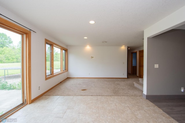 11905 Hunter Dr, Lake Park Twp, MN 56554 - empty room featuring baseboards, recessed lighting, and light carpet