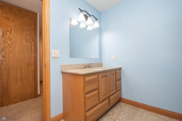 11905 Hunter Dr, Lake Park Twp, MN 56554 - bathroom with vanity, baseboards, and tile patterned floors