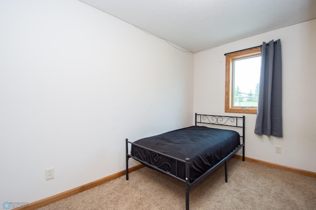 11905 Hunter Dr, Lake Park Twp, MN 56554 - carpeted bedroom featuring baseboards and lofted ceiling