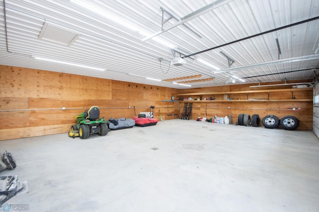 11905 Hunter Dr, Lake Park Twp, MN 56554 - garage featuring a garage door opener