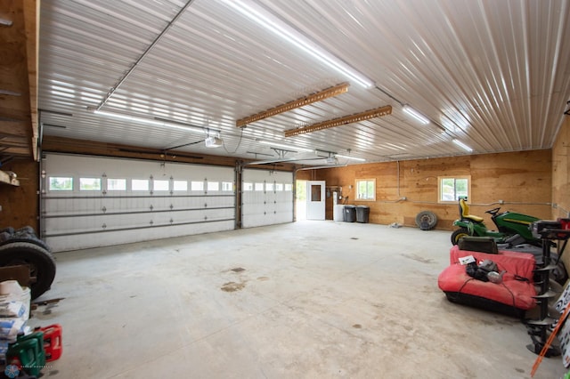 11905 Hunter Dr, Lake Park Twp, MN 56554 - garage featuring a garage door opener