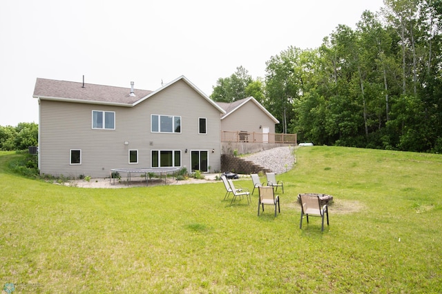 11905 Hunter Dr, Lake Park Twp, MN 56554 - rear view of property featuring a lawn and a deck