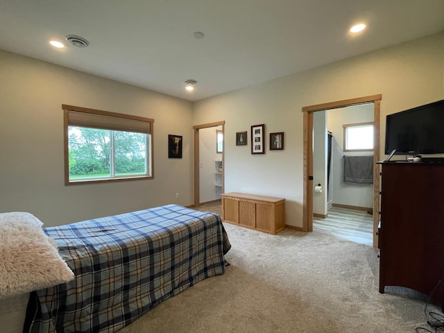1504 3rd Ave N, Cold Spring, MN 56320 - bedroom with multiple windows, light colored carpet, recessed lighting, and ensuite bathroom