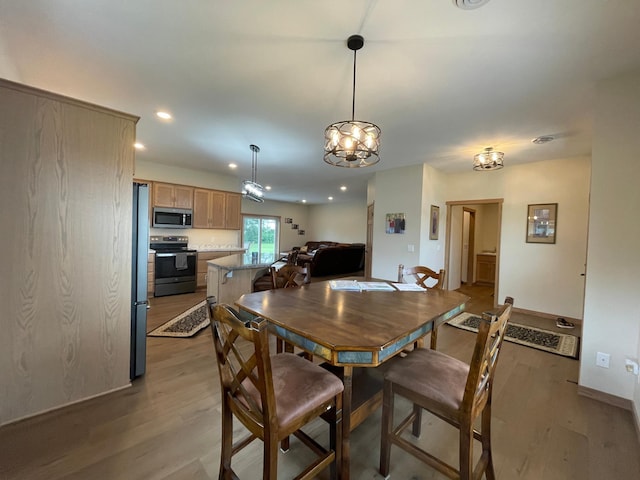 1504 3rd Ave N, Cold Spring, MN 56320 - dining space with light wood-type flooring, recessed lighting, and a chandelier