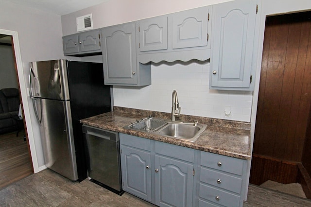 1979 Polaris Pl N, Saint Paul, MN 55109 - kitchen featuring dishwashing machine, gray cabinets, dark countertops, and freestanding refrigerator