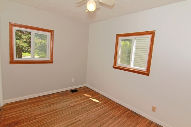 1979 Polaris Pl N, Saint Paul, MN 55109 - empty room featuring light wood-style flooring and ceiling fan