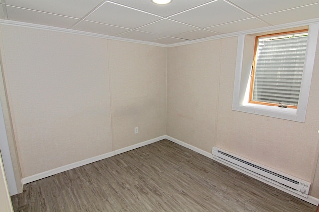 1979 Polaris Pl N, Saint Paul, MN 55109 - unfurnished room with a baseboard heating unit, wood finished floors, and crown molding