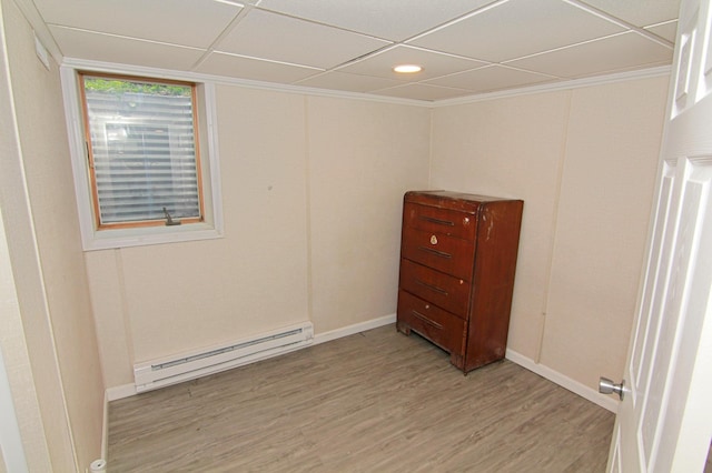 1979 Polaris Pl N, Saint Paul, MN 55109 - unfurnished room with a baseboard radiator, light wood-style floors, a paneled ceiling, and recessed lighting