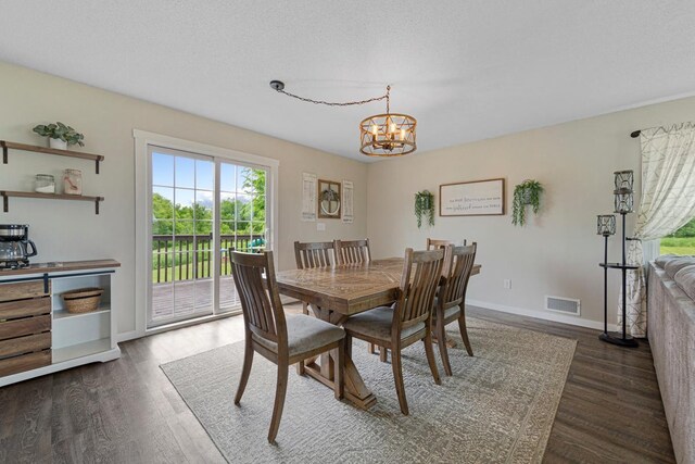 28145 State Highway 112, Le Sueur, MN 56058 - dining area featuring a chandelier, wood finished floors, and baseboards
