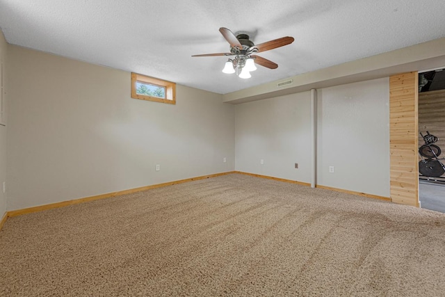 28145 State Highway 112, Le Sueur, MN 56058 - carpeted spare room with baseboards, ceiling fan, and a textured ceiling