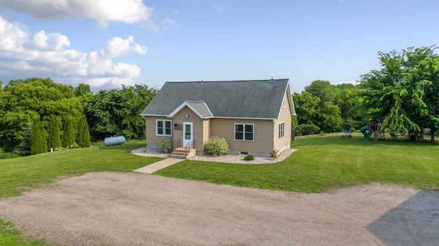 28145 State Highway 112, Le Sueur, MN 56058 - view of front of home featuring a playground, a front lawn, and roof with shingles