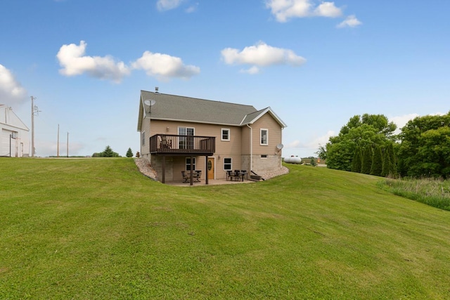 28145 State Highway 112, Le Sueur, MN 56058 - back of property featuring a patio area, a yard, and a wooden deck