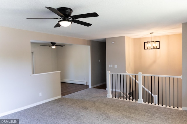 1322 17th St W, Hastings, MN 55033 - carpeted empty room featuring baseboard heating, a chandelier, ceiling fan, and baseboards