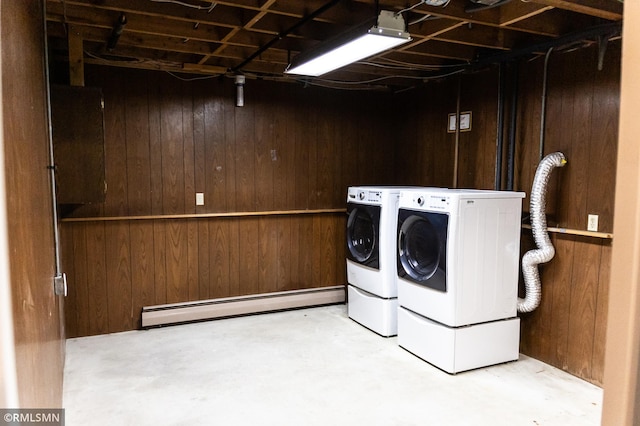 1322 17th St W, Hastings, MN 55033 - laundry area featuring a baseboard radiator, wooden walls, and washing machine and dryer