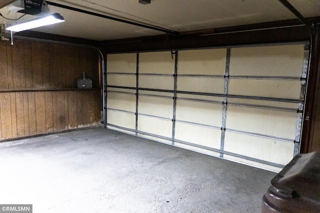 1322 17th St W, Hastings, MN 55033 - garage featuring wood walls and a garage door opener