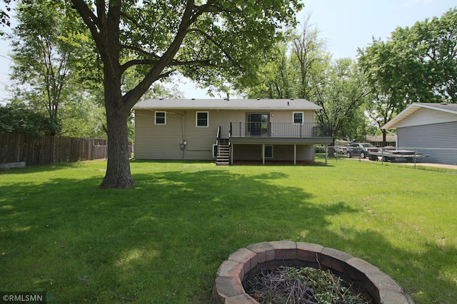 1322 17th St W, Hastings, MN 55033 - rear view of property featuring a deck, an outdoor fire pit, and stairs